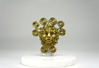 A large and bold dimensional lion head brooch surrounded by an artfully coiled “mane.” He has glittering green gem eyes. The brooch also features a hook which enables it to be worn as a pendant.  Period: 1960’s Designer: Goldette. Available at fonfrege.com
