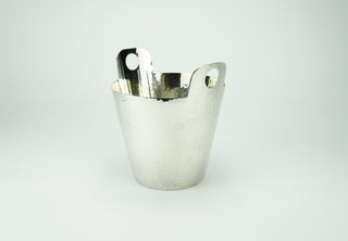 Calegaro was founded in 1921 and is one of Italy’s most famous silversmiths. This midcentury champagne bucket is hand-finished with hammered silverplate. Hallmarked at the rim. Very good condition with very minor wear.  Designer: Calegaro Period: Early 1960s Material: Silverplate Dimensions: 7”x 8” Condition: Very good. Available at fonfrege.com