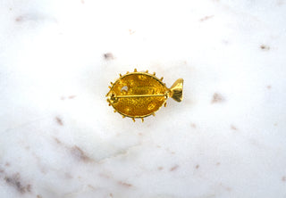Puffer Fish Brooch Pin. Designer: Napier Period: 1950s Dimensions: 1.5” Material: gold plated, faux pearls Condition: Excellent  While real puffer fish are deadly if eaten incorrectly, we suggest wearing this spiky little gem on your collar, if only to keep toxic people away from you. Available at Fonfrege.com