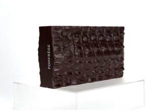 The Lagarto is our newest edition of minaudières to our Heritage Collection. Made from custom molded resin, the reptilian exterior is richly textured. Available in Arabian Green or Cabernet. Crocodile Clutch. Available at Fonfrege.com